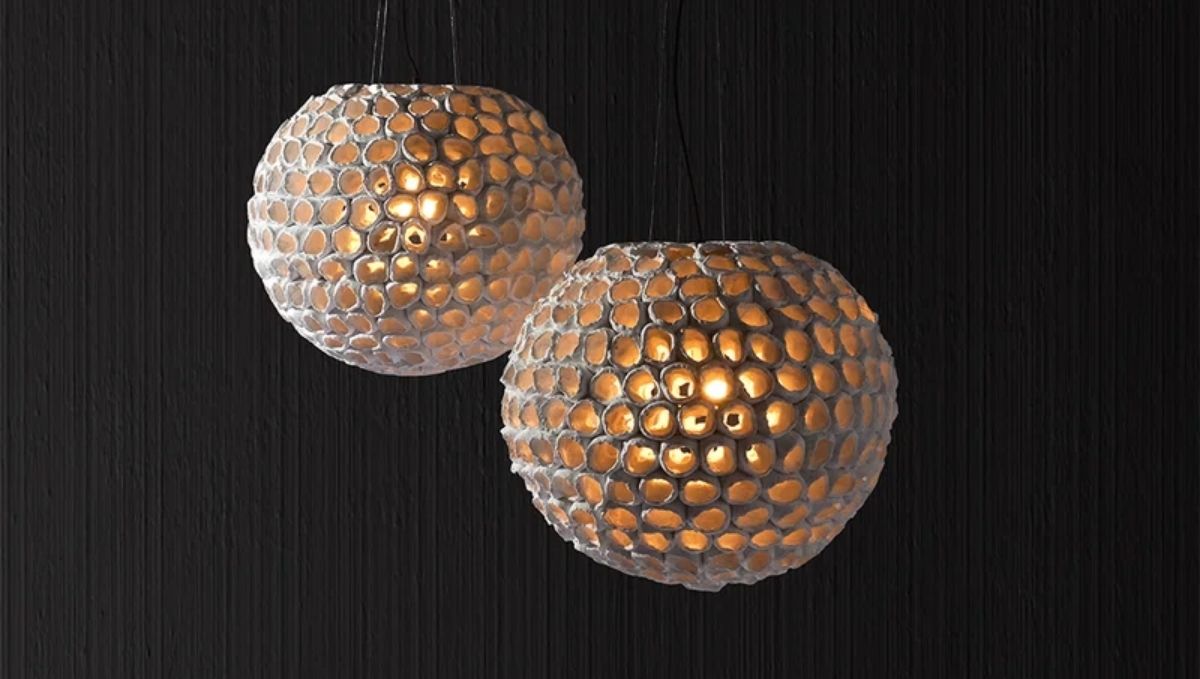 Two sculptural pendant lights showcasing enduring elegance in bespoke lighting design.