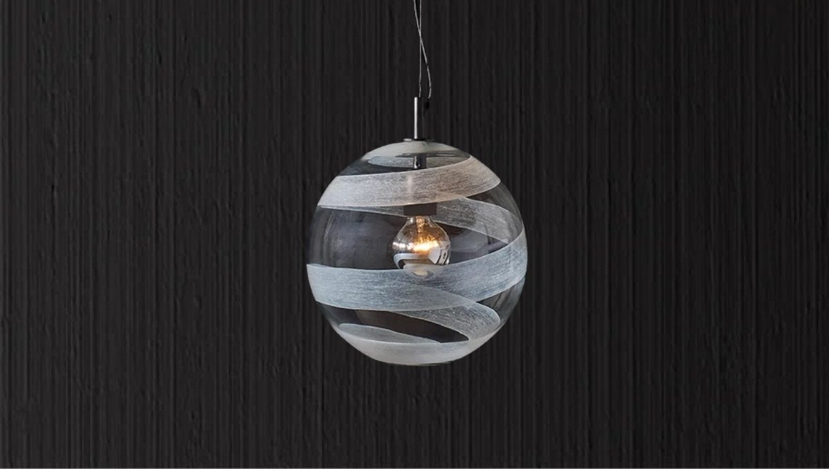 Italian-made glass globe pendant with sculptural detailing and warm illumination.