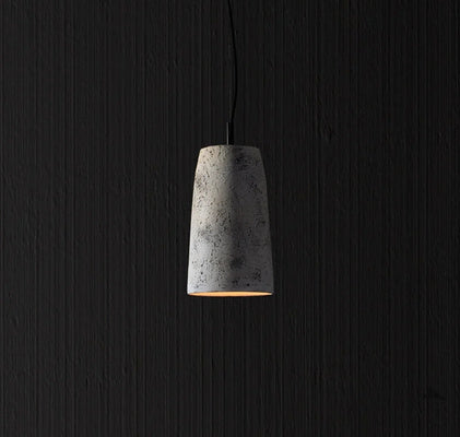 Minimalist concrete pendant light with warm glow for modern interior design by RENGCO