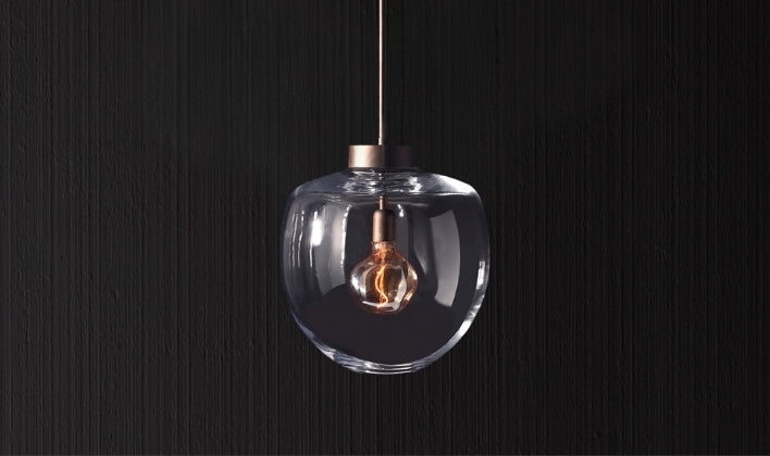 Handcrafted glass globe pendant light in artisan lighting collection
