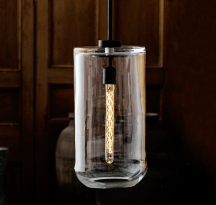 Handcrafted glass pendant light with exposed filament in artisan lighting collection