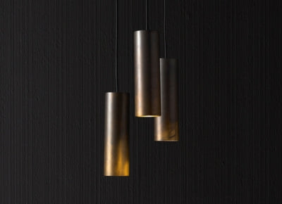 Handcrafted metal cylinder pendant lights in artisan lighting collection