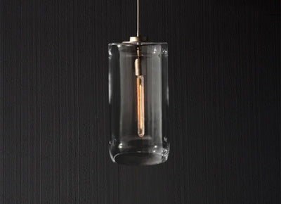 Modern glass pendant light by Artisan Lighting Company, featuring a crystal design, suspended from the ceiling.