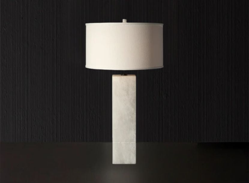 Artistic alabaster table lamp with a rectangular base and classic white drum shade