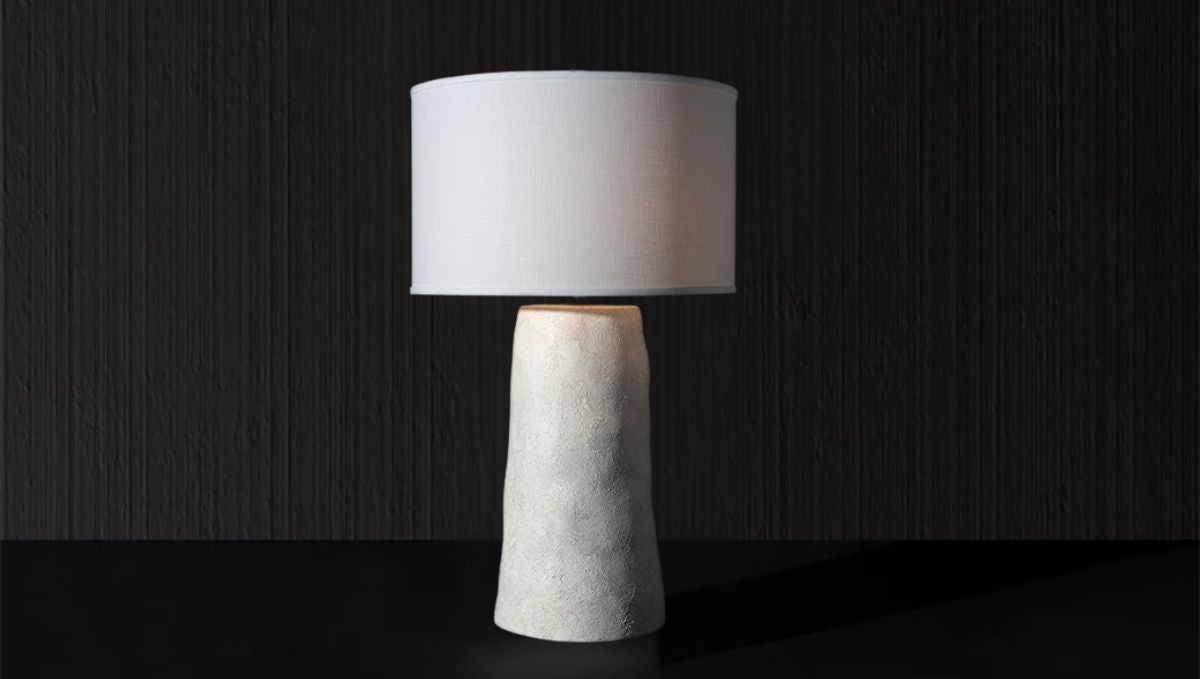 Italian-made artistic table lamp with textured white base and classic drum shade
