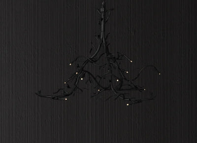 Black branch-style pendant light with small illuminated tips from a bespoke metal lighting collection.