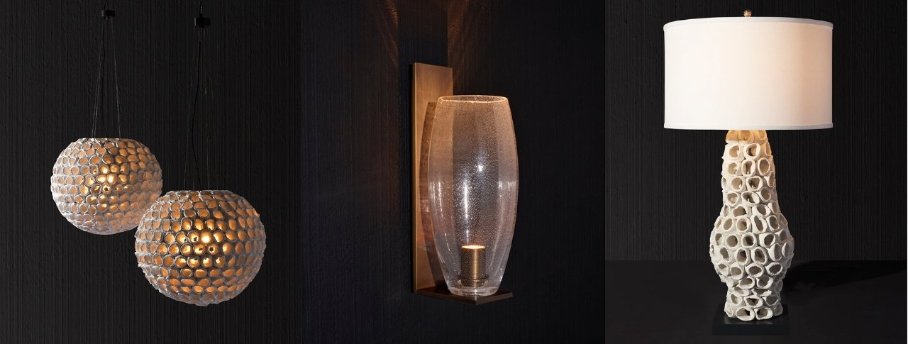 A collection of three distinct lamps alongside a decorative lamp shade, representing luxury home custom lighting.