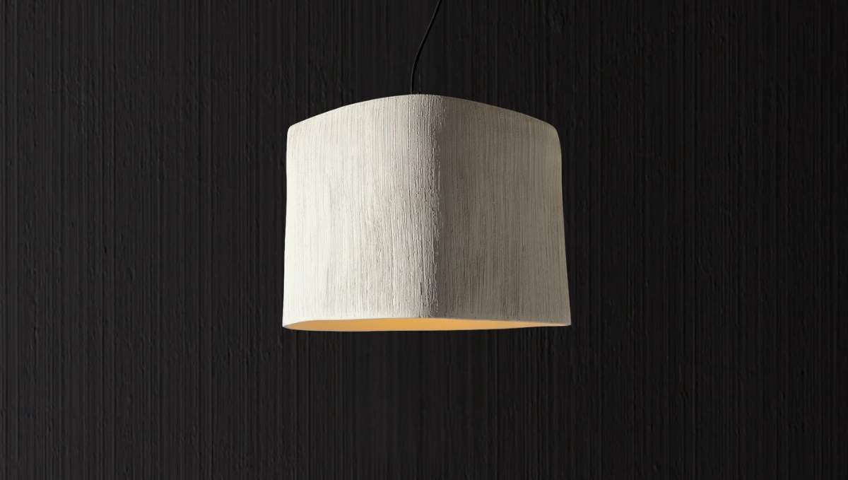 Italian textured drum pendant light with soft warm glow and handcrafted finish