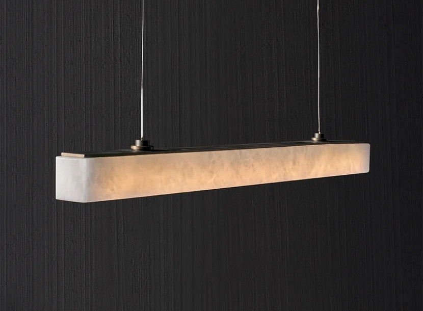 Modern alabaster linear pendant light with warm glow for elegant interiors by RENGCO
