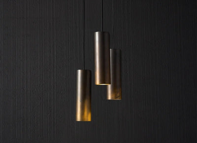 Modern metal pendant lights with cylindrical design and warm glow by RENGCO